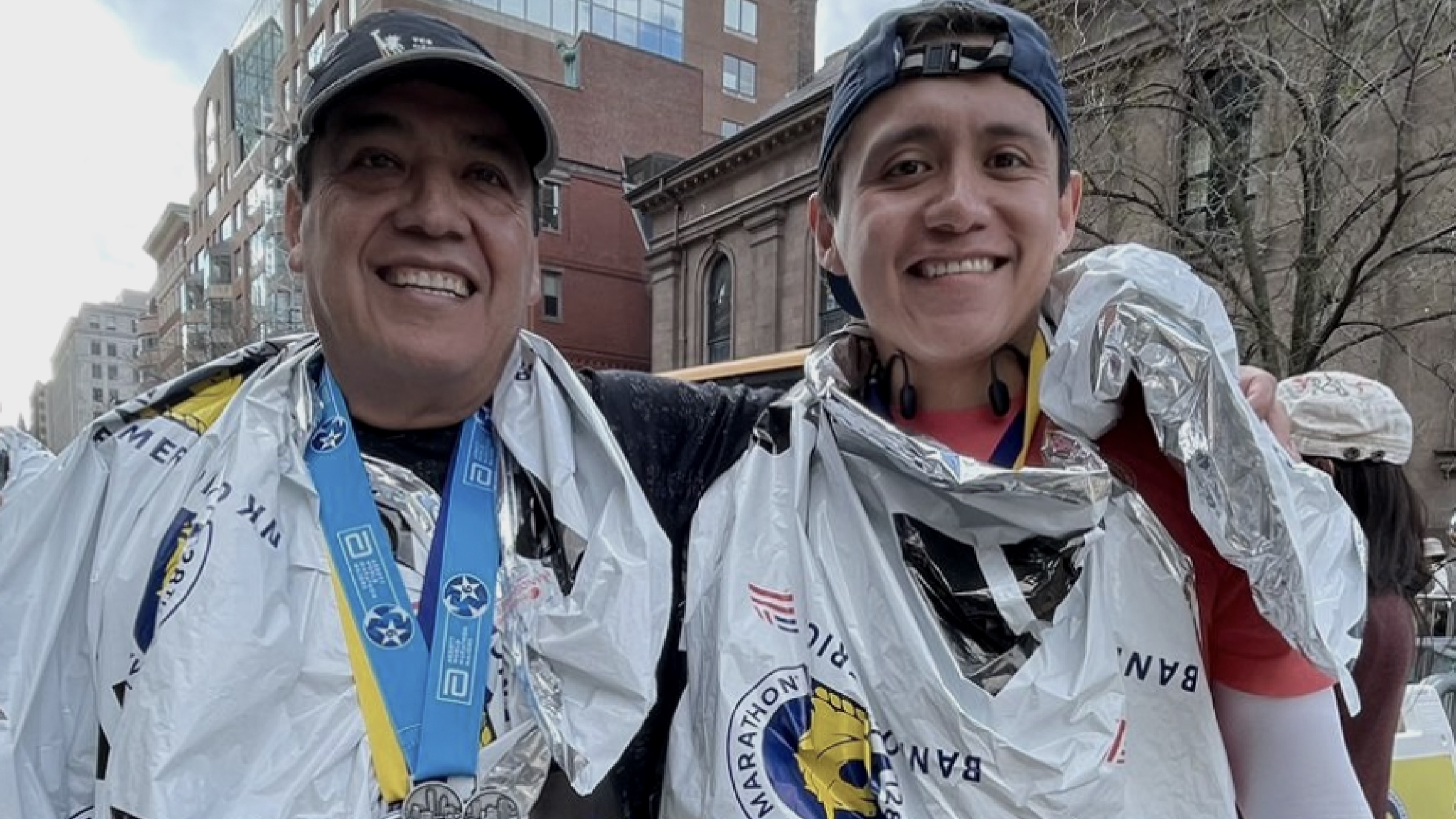 Omar and his father at the Boston Marathon finish